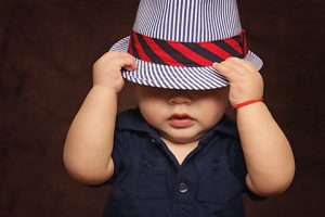 Baby Boy Playing with Hat