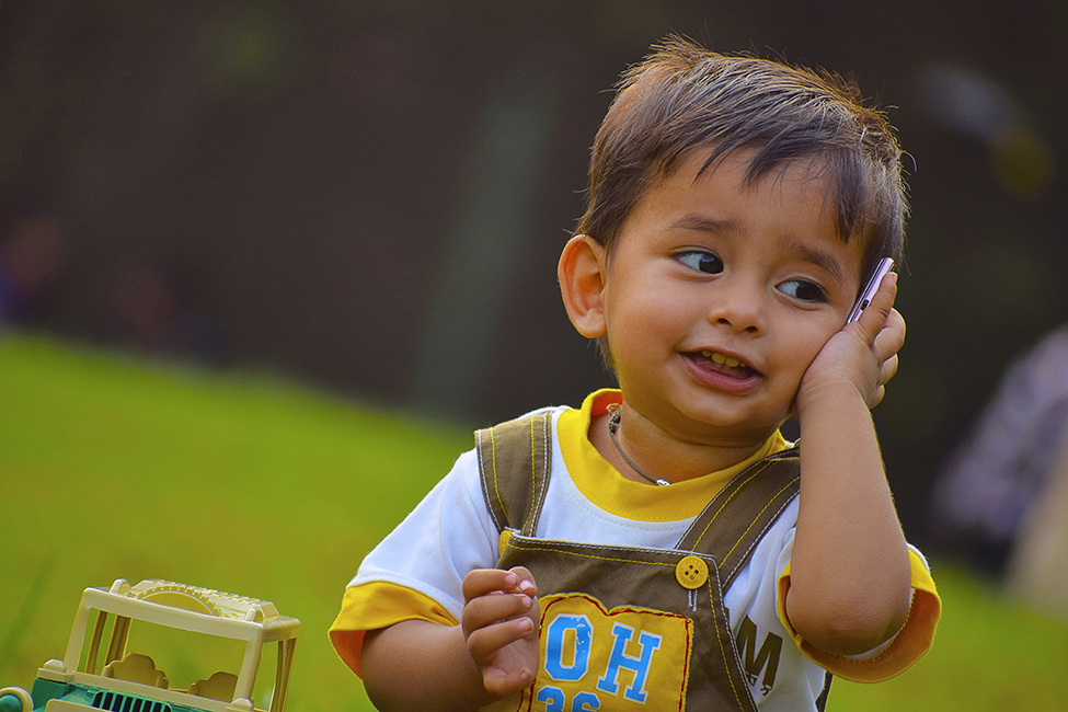 Child Holding Phone