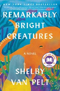 'Remarkably Bright Creatures' by Shelby Van Pelt book cover with a giant Pacific octopus in an aquarium with a woman looking at him.